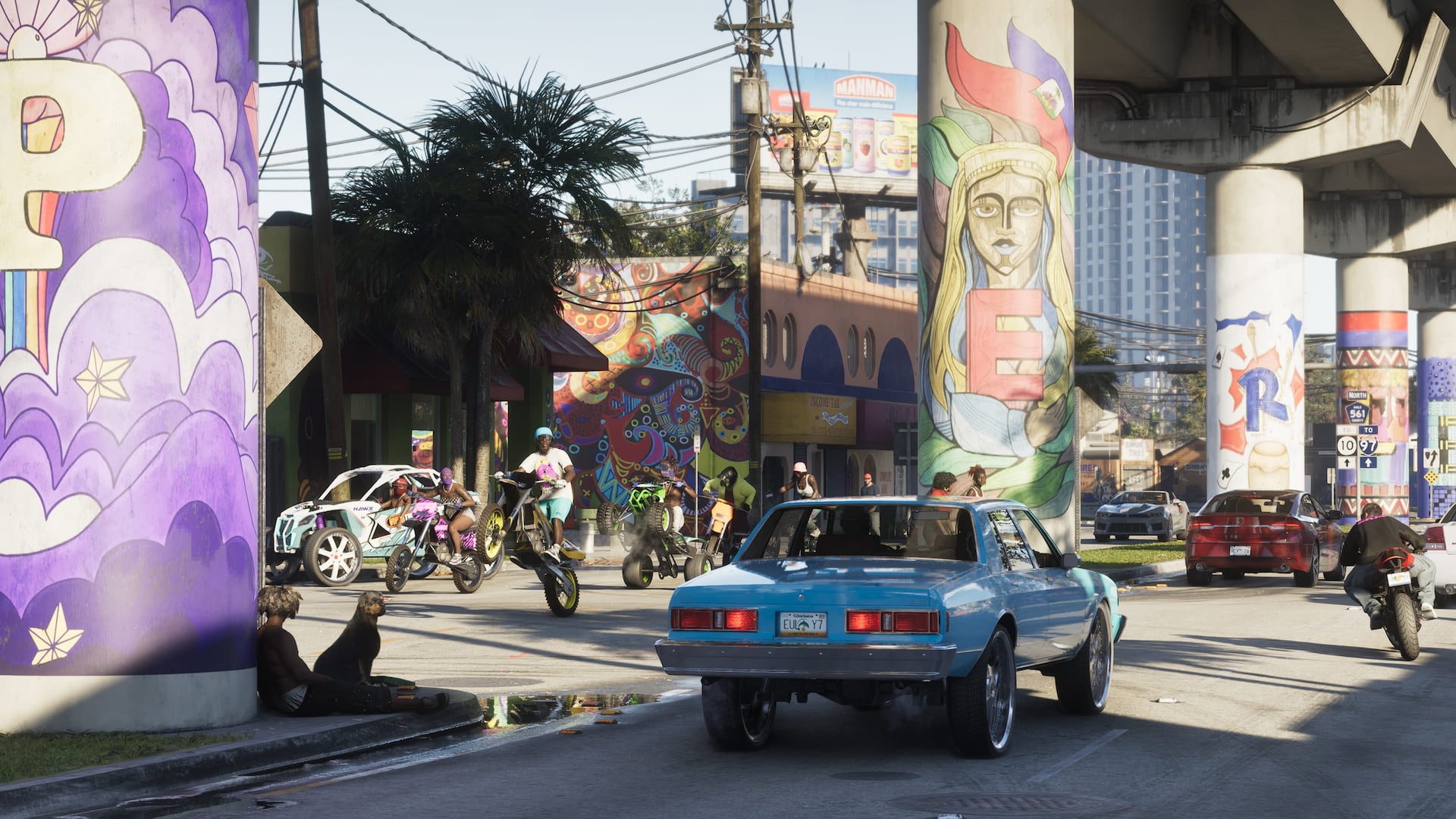 A car and cyclists pass colorful murals beneath an elevated roadway in Vice City.